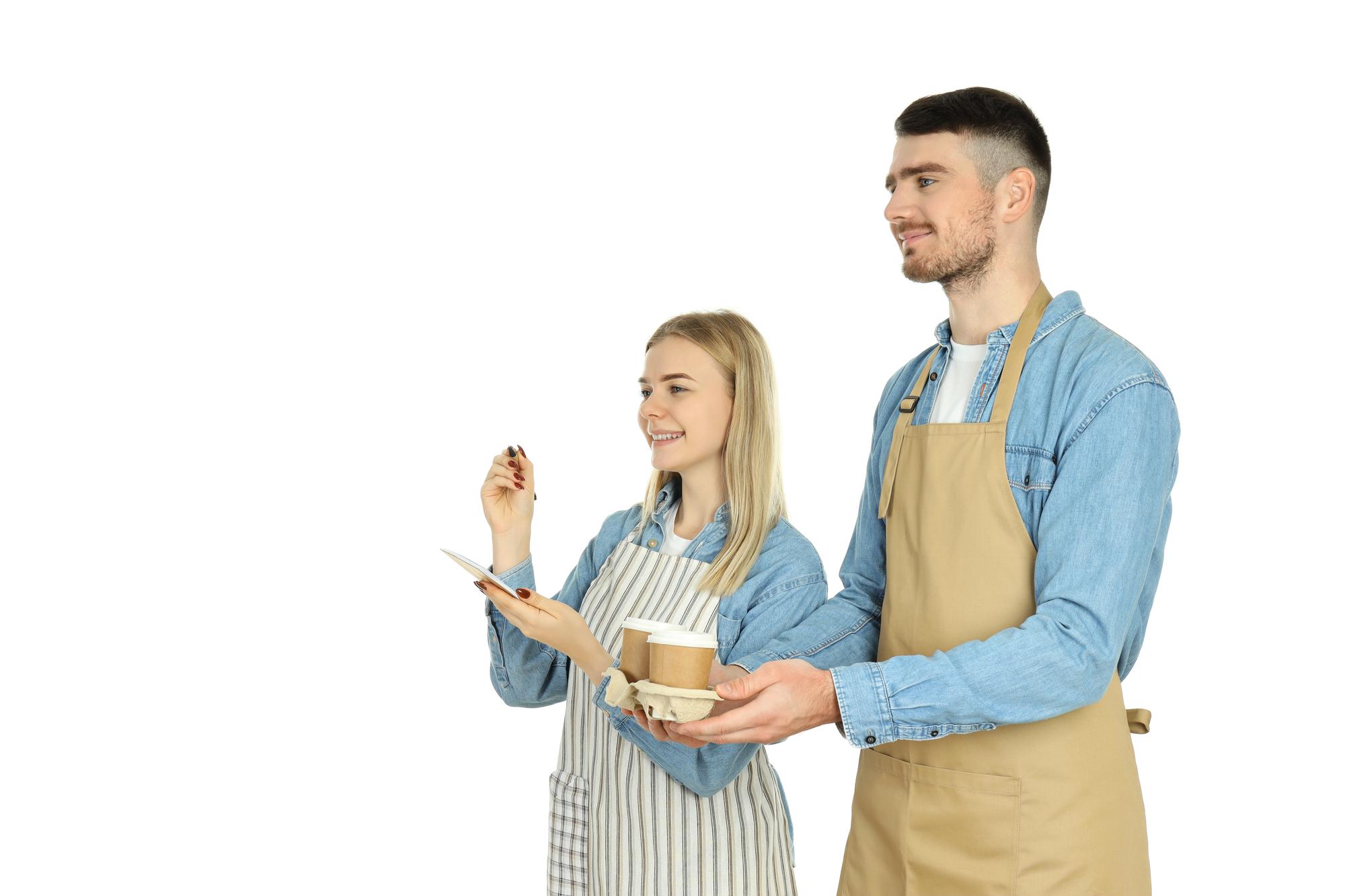 Chef and collaborator discussing a plate